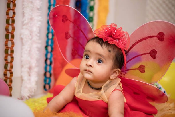 Baby in a red butterfly getup