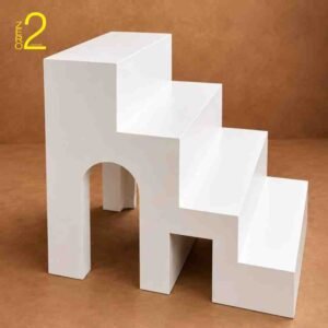 White staircase photography prop with geometric openings for maternity photoshoots and creative studio portraits.