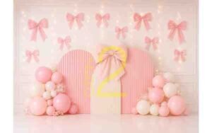 Baby girl pink bow theme photography backdrop with pastel balloons and decorative bows