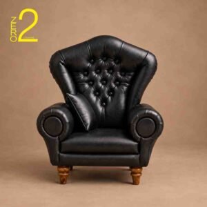 Black premium tufted sofa baby photography prop with rolled armrests, matching cushion, and wooden legs.
